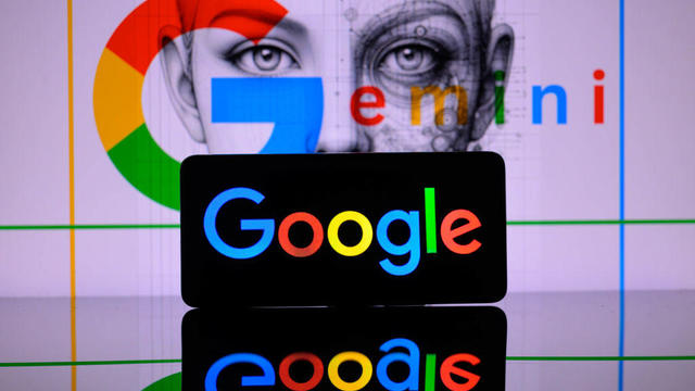 A smart phone displaying Google with Google Gemini in the background is featured in this photo illustration in Brussels, Belgium, on Feb. 8, 2024. 
