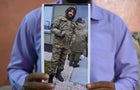 Mohammed Imran shows a picture of his brother Mohammed Asfan along the Russian border with Ukraine, at their home in Hyderabad, India, on Feb. 22, 2024. 