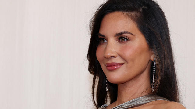 Olivia Munn poses on the red carpet during the Oscars arrivals at the Academy Awards in Hollywood, Los Angeles, California, March 10, 2024. 