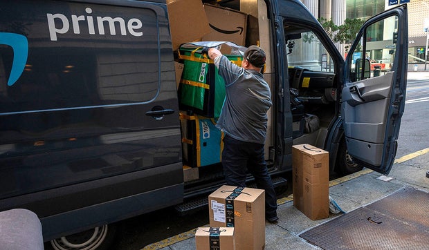 Amazon Prime delivery trucks and drivers