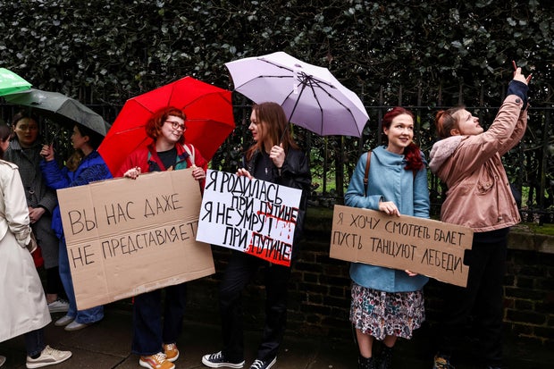 People vote on the final day of the presidential election in Russia, in London