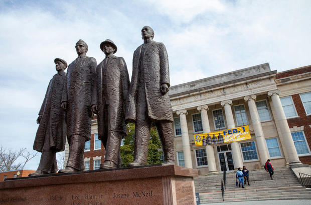A statue of four men, the Greensboro Four, outside at North Carolina A&T State University. 