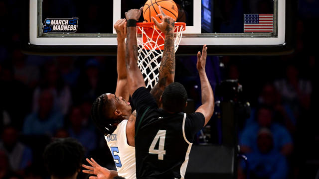 Armando Bacot #5 of the North Carolina Tar Heels dunks the ball over Tyje Kelton #4 of the Wagner Seahawks in the first half during the first round of the NCAA Men's Basketball Tournament at Spectrum Center on March 21, 2024 in Charlotte, North Carolina. 