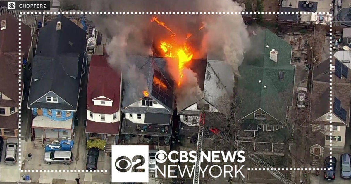 At least 1 injured as fire spreads across 2 homes in Brooklyn - CBS New ...
