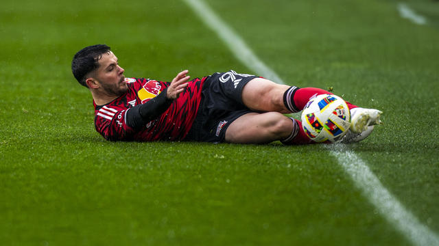 New York Red Bulls Lewis Morgan (9) slides to play the ball during an MLS soccer match against Inter Miami, Saturday, March 23, 2024, in Harrison, N.J. 