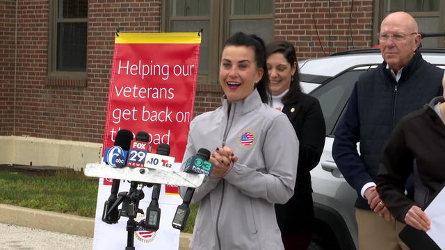 Erica Liermann smiles as she speaks to the press after receiving a car. 