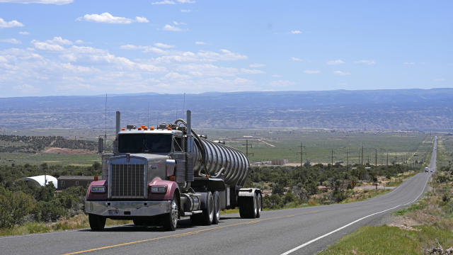 A tanker truck transports crude oil on a highway near Duchesne, Utah, on July 13, 2023. 