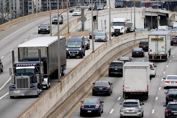 Motor vehicle traffic moves along I-76 in Philadelphia on March 31, 2021.