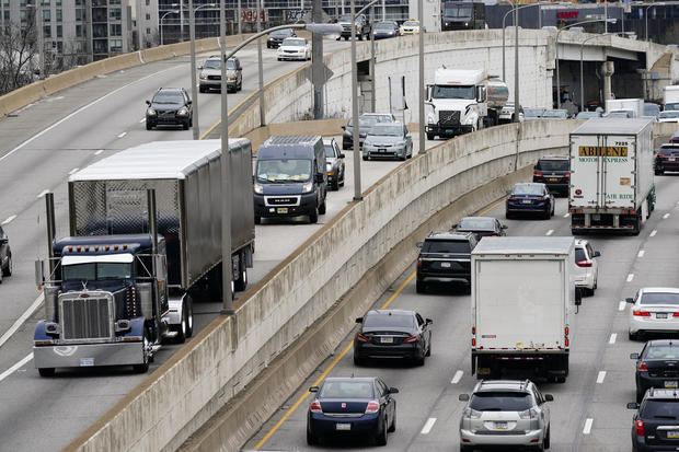 Motor vehicle traffic moves along I-76 in Philadelphia on March 31, 2021. 