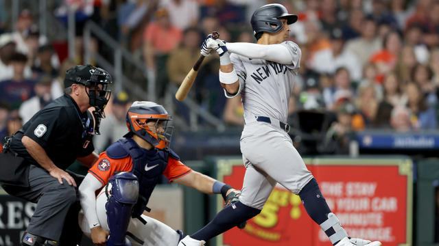 Oswaldo Cabrera #95 of the New York Yankees hits an RBI single in the seventh inning against the Houston Astros at Minute Maid Park on March 29, 2024 in Houston, Texas. 