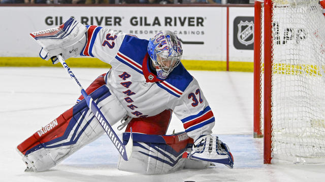 New York Rangers Goalie Jonathan Quick (32) freezes the puck during the second period of an NHL game between the Arizona Coyotes and New York Rangers on March 30, 2024, at Mullett Arena in Tempe, AZ. 