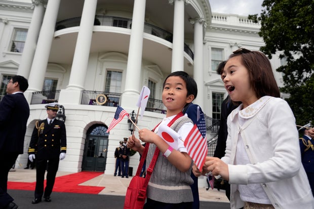 School children arrive to watch President Biden and first lady Jill Biden welcome Japanese Prime Minister Fumio Kishida and his wife Yuko Kishida to the White House on Wednesday, April 10, 2024.