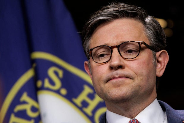 Speaker of the House Mike Johnson listens during a press conference following a House GOP caucus meeting at the Capitol on April 10, 2024.