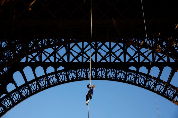 Athlete Anouk Garnier attempts the world record for rope climbing on the Eiffel Tower in Paris