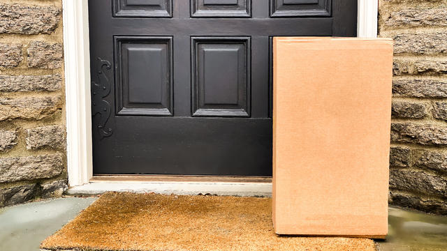 large brown box package left at front residential door 