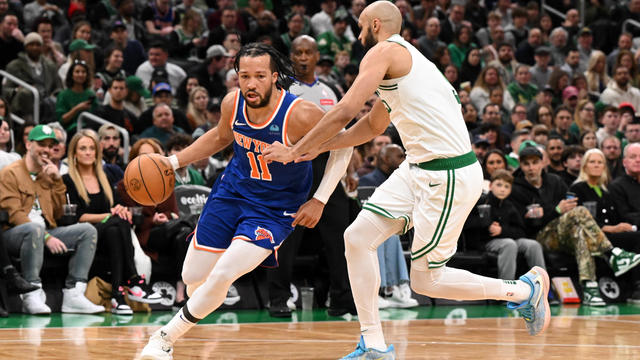 Jalen Brunson #11 of the New York Knicks drives to the basket against Derrick White #9 of the Boston Celtics during the second quarter at the TD Garden on April 11, 2024 in Boston, Massachusetts. 