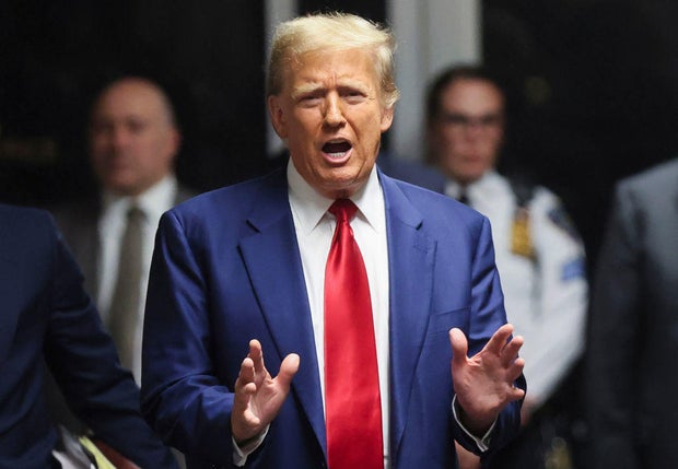 Former President Donald Trump speaks to members of the media in the hallway outside a courtroom at Manhattan Criminal Court in New York on Monday, March 25, 2024.
