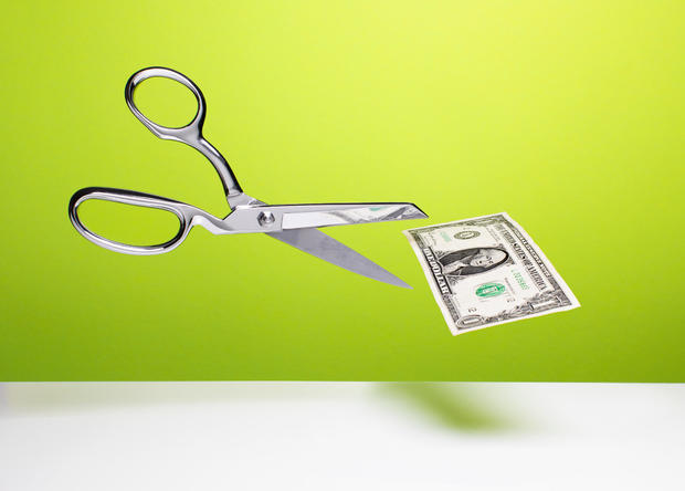 Cutting the budget - Scissors and dollar 