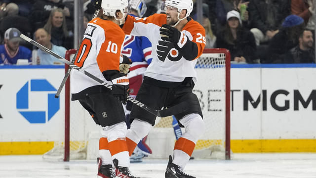 Philadelphia Flyers right wing Bobby Brink (10) celebrates with center Ryan Poehling (25) after scoring against the New York Rangers 