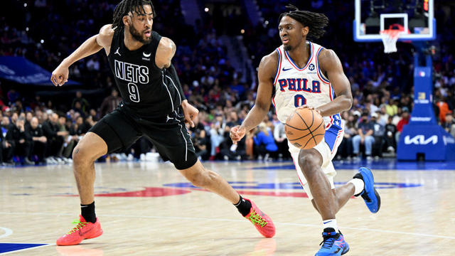 Tyrese Maxey #0 of the Philadelphia 76ers handles the ball in the second quarter against Trendon Watford #9 of the Brooklyn Nets at the Wells Fargo Center on April 14 