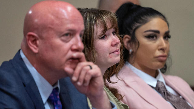 Hannah Gutierrez-Reed, who was the armorer for the movie "Rust," sits with her attorney Jason Bowles and paralegal Carmella Sisneros during her sentencing hearing at First District Court, in Santa Fe, New Mexico, April 15, 2024. 