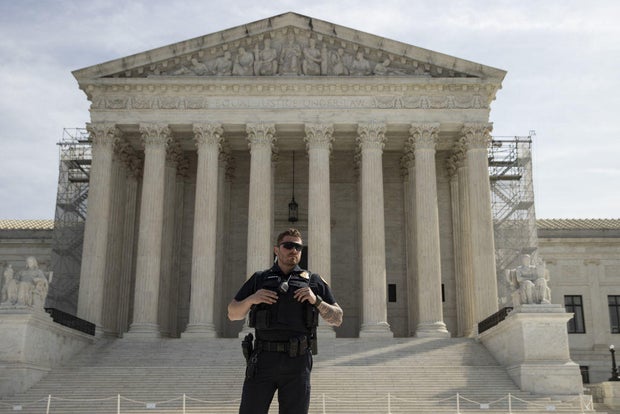 A police outside the Supreme Court on March 26, 2024.