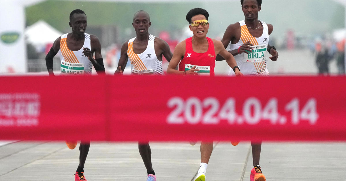 Beijing half-marathon organizers investigating whether competitors let  Chinese runner win - CBS News