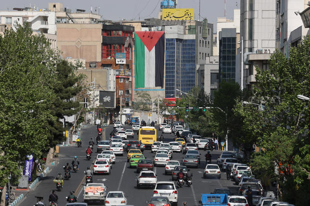 A huge Palestinian flag is seen on a building in a street in Tehran 