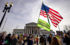 Demonstrators protest and argue outside the U.S. Supreme 