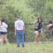 Group caught on camera pulling bear cubs from tree to take pictures