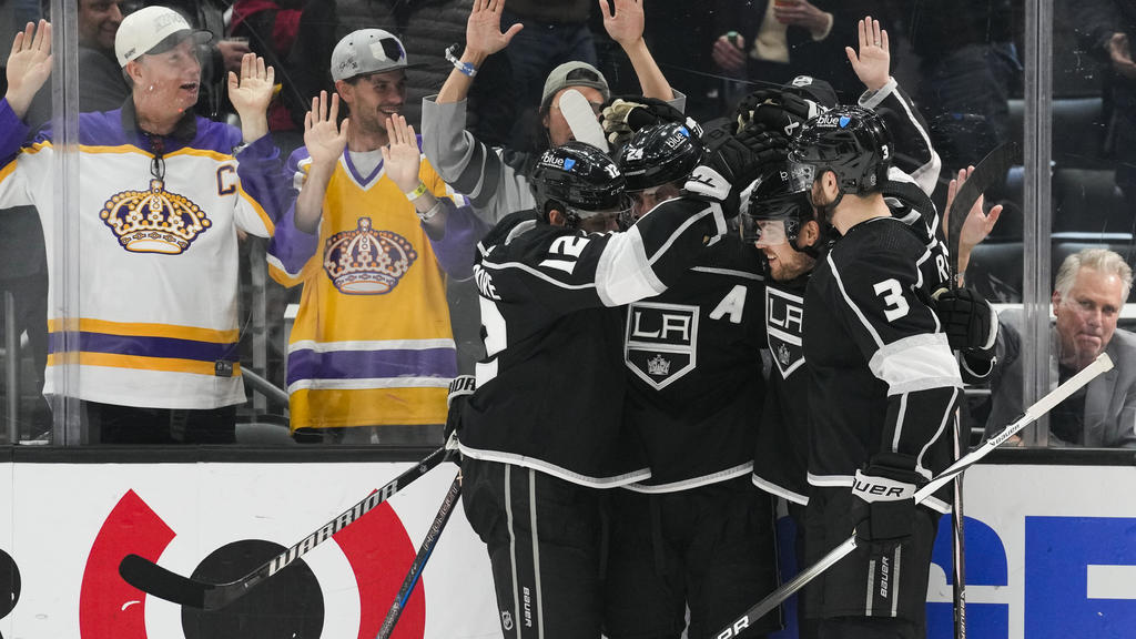Kings rally late, finish 3rd in the Pacific Division with a 5-4
overtime victory over Blackhawks