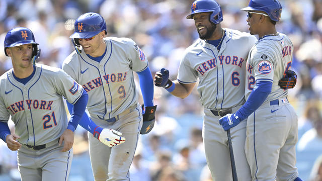 Starling Marte #6 of the New York Mets is congratulated by Zack Short #21, Brandon Nimmo #9 and Francisco Lindor #12 after hitting a 3-run home run in the sixth inning against the Los Angeles Dodgers at Dodger Stadium on April 20, 2024 in Los Angeles, Cal 