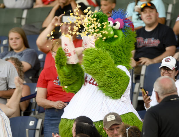 The Phillie Phanatic spills popcorn all over spectators. The New Hampshire Fisher Cats vs. the Reading Fightin Phils at FirstEnergy Stadium in Reading Friday evening July 1, 2019 for a Double A baseball game. Photo by Ben Hasty 