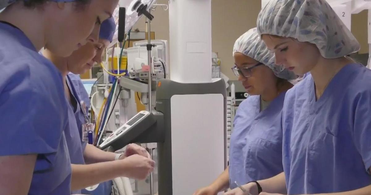 Surgeon from Mercy Hospital introduces high school students to the field of robotic surgery