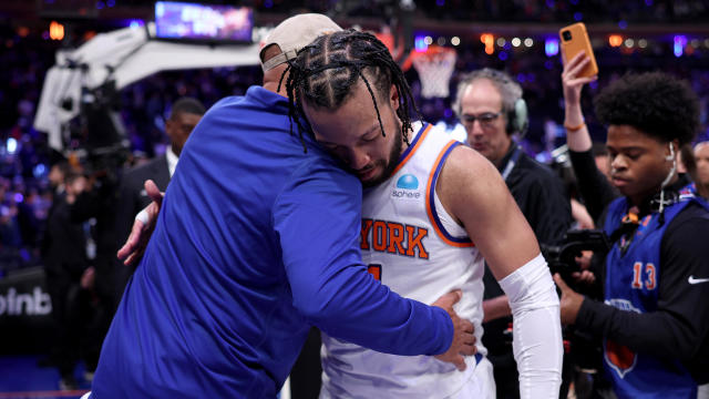 Jalen Brunson #11 of the New York Knicks is congratulated by former New York Knicks John Starks after game one of the Eastern Conference First Round Playoffs at Madison Square Garden on April 20, 2024 in New York City. 