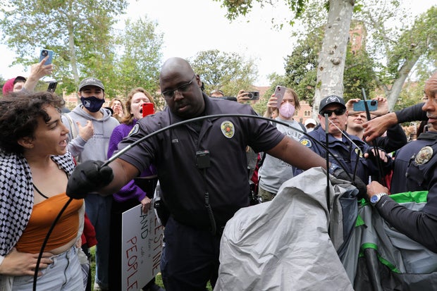 University of Southern California safety officers try to disperse students protesting Israel's war in Gaza, at the school's Alumni Park in Los Angeles, California, April 24, 2024.