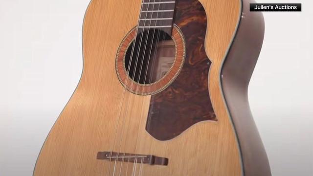 A close-up of an acoustic guitar. 