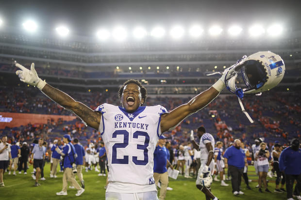 Andru Phillips #23 of the Kentucky Wildcats celebrates after defeating the Florida Gators 26-16 in a game at Ben Hill Griffin Stadium on September 10, 2022 in Gainesville, Florida. 