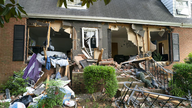 The house where eight law enforcement officers were shot while serving a warrant for possession of a firearm by a felon is seen a day later on April 30, 2024, in Charlotte, North Carolina. 