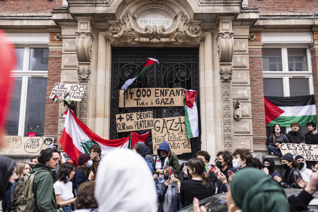 Students block the entrance of the ESJ Superior School of Journalism in Lille, northern France, May 2, 2024, during a pro-Palestinian solidarity demonstration amid Israel's war with Hamas in Gaza. 