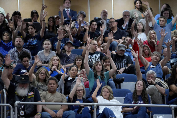 Members of the gallery at the Arizona Capitol wave their hands in silent disapproval on Wednesday, May 1, 2024, in Phoenix. 