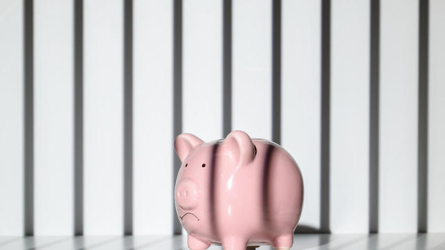 Piggy bank trapped inside a prison 