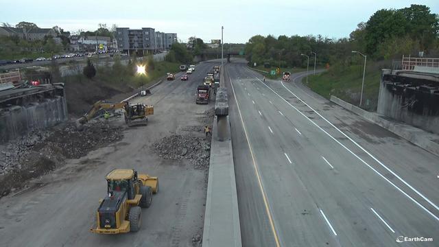 A view of I-95 in Norwalk. The Fairfield Avenue overpass has been demolished. Northbound lanes are clear of debris and lines have been repainted. Construction vehicles and debris remain in the southbound lanes. 