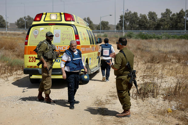 Israeli soldiers and medics locomotion adjacent an ambulance aft Palestinian Islamist group Hamas claimed work for an onslaught connected Kerem Shalom crossing 