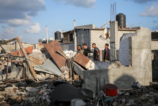 Palestinians inspect the site of an Israeli strike on a house amid the ongoing conflict between Israel and Hamas, in Rafah, in the southern Gaza Strip on May 7, 2024. 