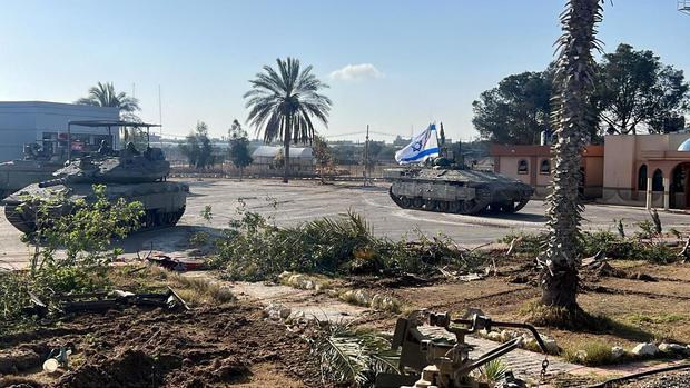 Israeli military vehicles operate on the Gaza side of the Rafah border crossing with Egypt, amid the ongoing conflict between Israel and the Palestinian militant group Hamas, in the southern Gaza Strip, in a handout image released May 7, 2024, by the Israel Defense Forces. 