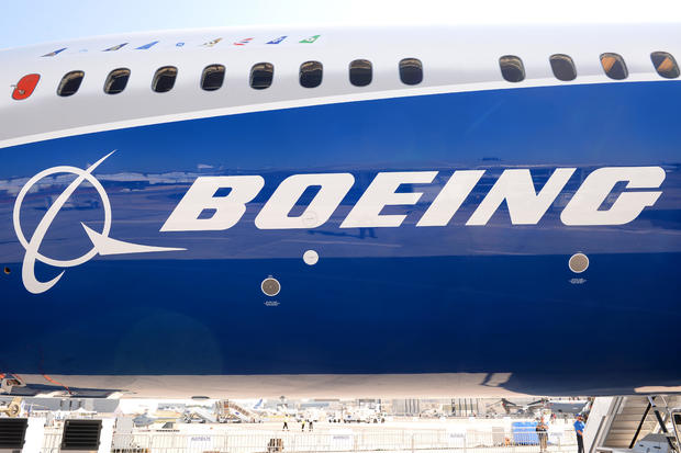 The Boeing logo is seen on the fuselage of a Boeing 787-10 Dreamliner test plane on the tarmac of Le Bourget on June 18, 2017, on the eve of the opening of the International Paris Air Show. 
