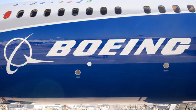 The Boeing logo is seen on the fuselage of a Boeing 787-10 Dreamliner test plane on the tarmac of Le Bourget on June 18, 2017, on the eve of the opening of the International Paris Air Show. 