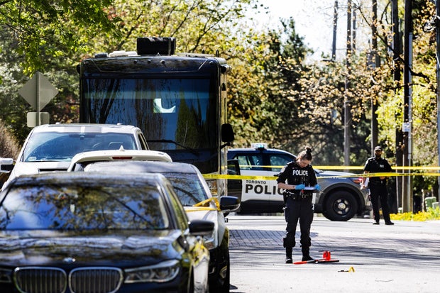 Officers with the Toronto Police Service are seen outside Canadian rapper Drake's mansion in Toronto, May 7, 2024.