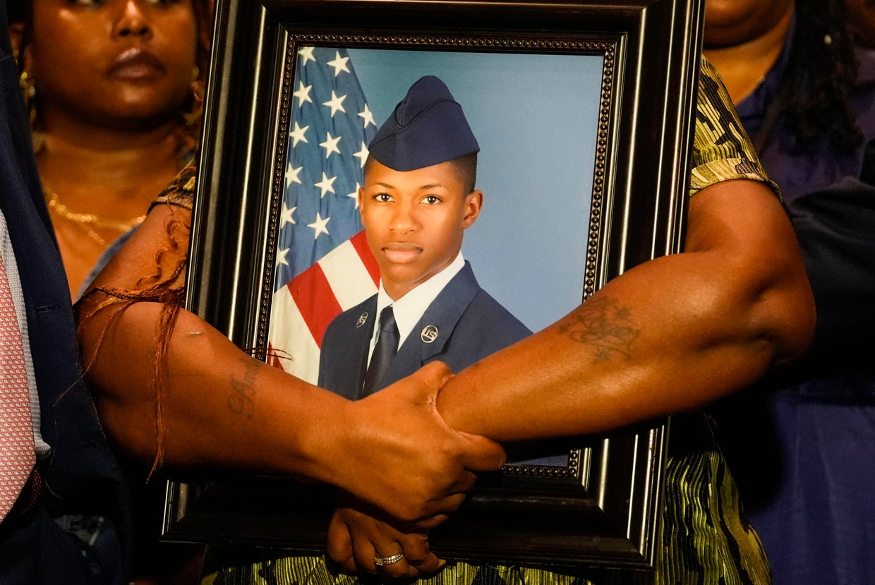 Chantemekki Fortson, mother of Roger Fortson, a U.S. Air Force senior airman, holds a photo of her son during a news conference regarding his death, along with family and attorney Ben Crump, May 9, 2024, in Fort Walton Beach, Florida. 